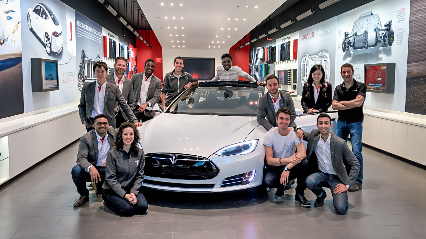 The early Tesla team inside the showroom